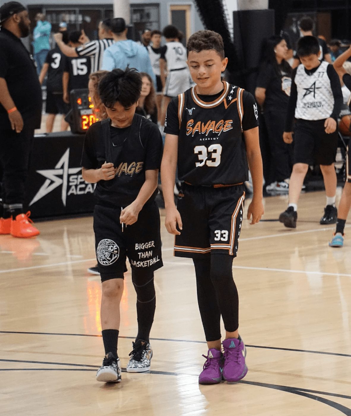 Two Savage players on the court