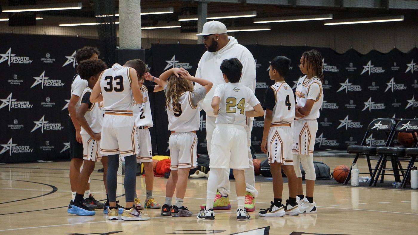 Coach Courtney with the 11U team